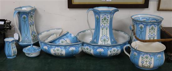 Ford & Sons, Crownford, Burslem, an eight-piece toilet set decorated with stylised cornflowers Jugs H.33cm